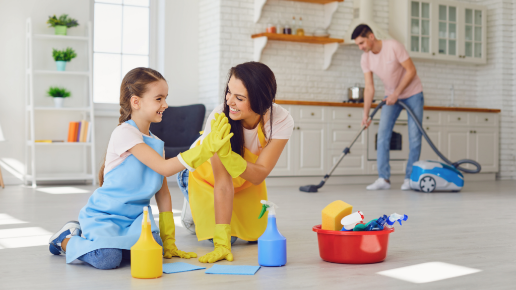 Happy family working together to clean the house