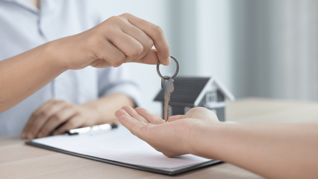 Home Buyer Receiving key to her new home